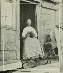 a woman knitting socks